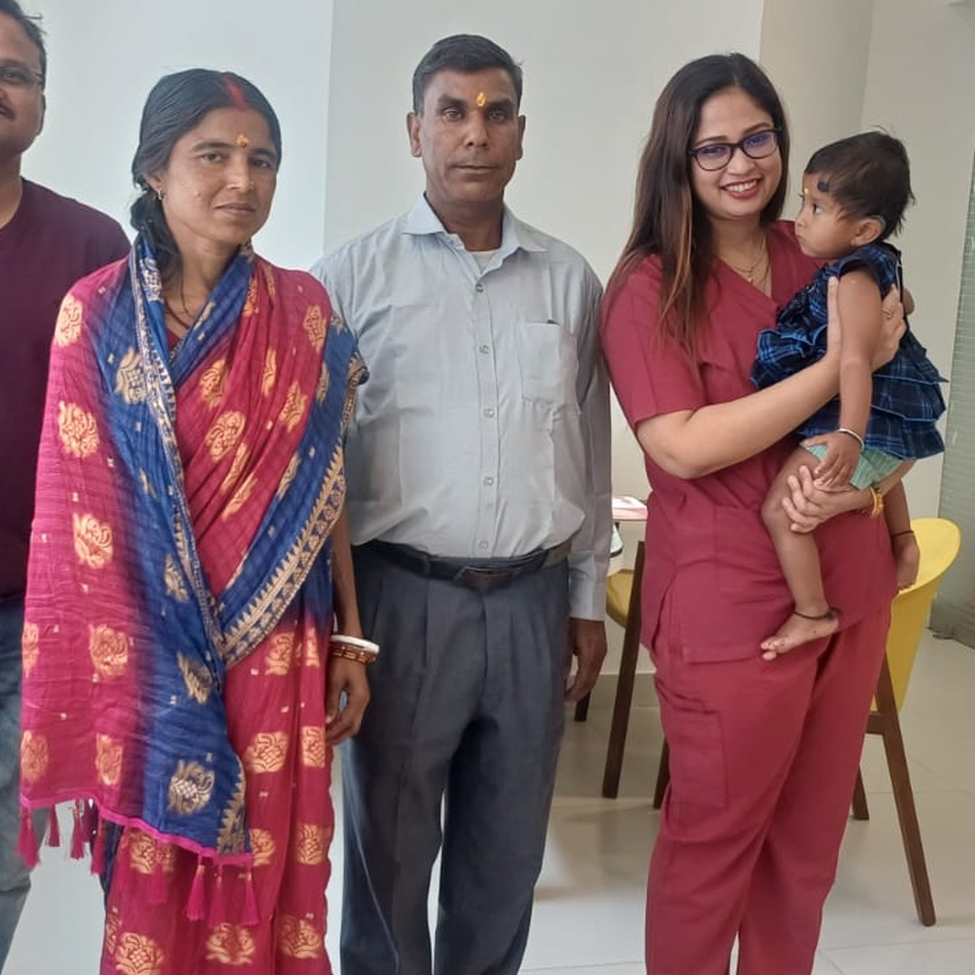 HomeIVF fertility specialists and nurses holding a newborn baby after IVF delivery