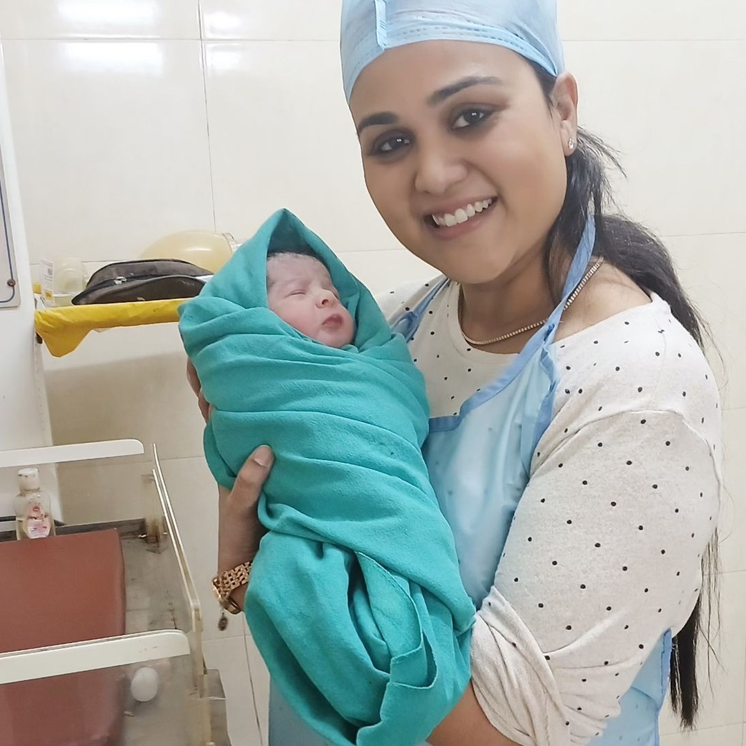 HomeIVF newborn baby swaddled in blankets after IVF delivery