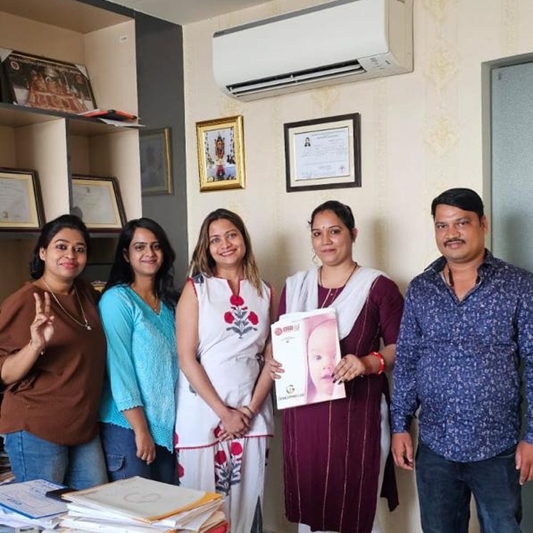 HomeIVF full delivery team posing with a newborn baby after IVF delivery